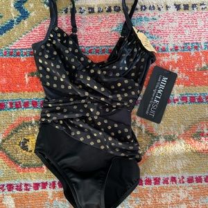 Never worn miraclesuite one piece swim suite with slimming design